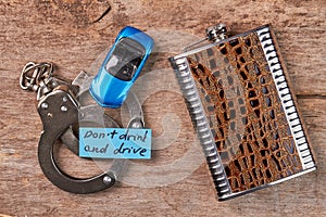 Handcuffs, toy car, message, hip flask.