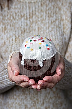 Handemade knitted Easter sweet bread in girl hand