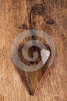 Handemade wooden heart on wooden background