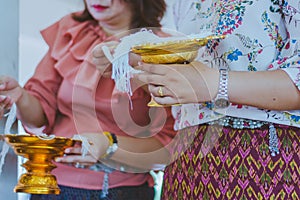 Handfasting. Selective focus on hands of Thai graduation ceremon