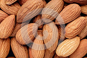 handful of almonds close up food background top view