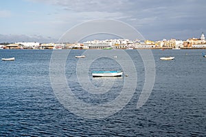 A handful of boats in the harbor during winter in Isla Cristina, Spain photo