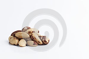 handful of Brazilian walnuton on a white background. close-up of raw nuts. healthy food isolated. copy space for text