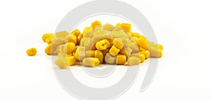 Handful of canned corn on white isolated background banner