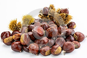 Handful of chestnuts on white background