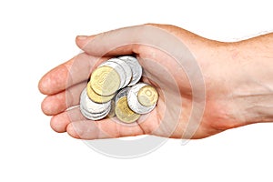A handful of coins in the palm of a hand, isolated.