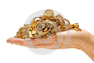 Hand holding gold jewelry photo