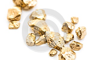 Handful of gold nuggets close-up photo