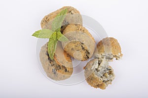 A handful of homemade croquettes of spinach isolated on white