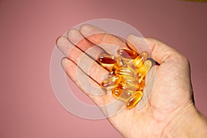 handful of Omega-3 capsules. Vitamins. Healthy lifestyle