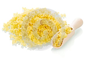 Handful of raw pasta closeup on white background