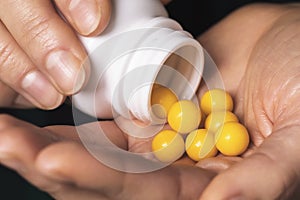 A handful of vitamins in the hand