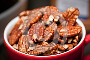 Handful of walnuts in a cup