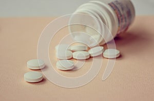 A handful of white large tablets, vitamins for health