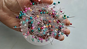 a handfull of colorfull pins