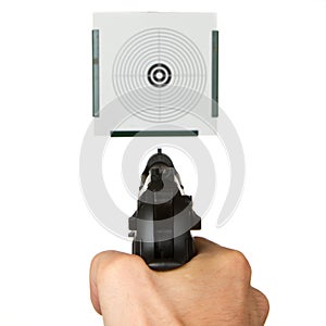 Handgun aimed on a shooting target