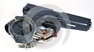 Handgun with handcuffs