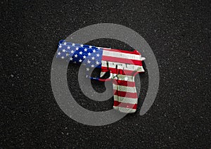 A handgun illustration with stars and stripes of the american flag color overlay to symbolize gun crime, suicide and murder with