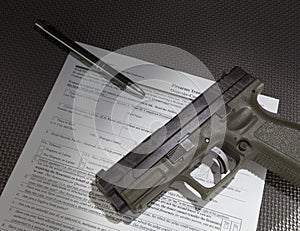 Handgun and paperwork
