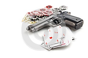 Handgun and poker cards