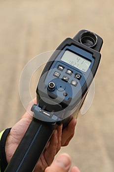 Handheld laser speed gun showing 41 MPH photo