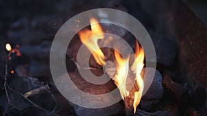 Handheld shot of charcoal in brazier, preparation for bbq photo