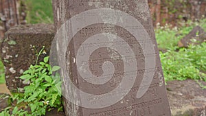 Handheld shot of ruins in the My Son Sanctuary, remains of an ancient Cham civilization in Vietnam. Ancient writtings on