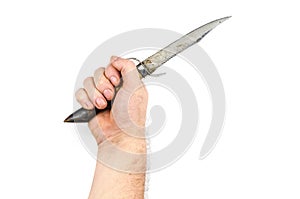 The handholds an old hunting knife made from a goat`s hoof on the white background. Knife with a saw and a handguard