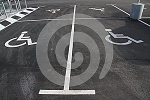 Handicap icon. Parking lot with handicap sign and symbol. Empty handicapped reserved parking space with wheelchair symbol. Disable