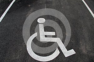 Handicap icon. Parking lot with handicap sign and symbol. Empty handicapped reserved parking space with wheelchair symbol. Disable