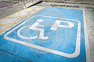 Handicap parking. Blue Disabled parking sign on asphalt, special place.
