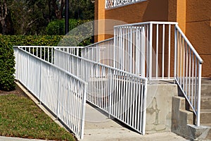 Handicap ramp with white railing