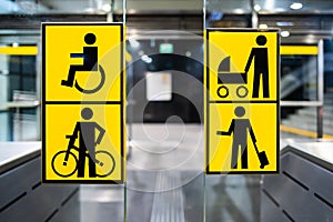 Handicapped, bicycle, stroller and big luggage yellow pictrogram in metro, information in public transport, no people