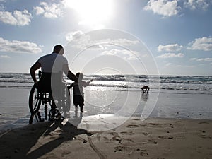 Handicapped Dad with Child photo