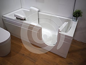 Handicapped disabled access bathroom bathtub with electric handles