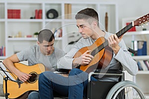 handicapped guitarists preparing for concert