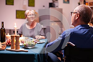 Handicapped man holding whine glass