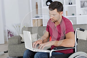 Handicapped man using laptop