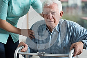 Handicapped man using walker