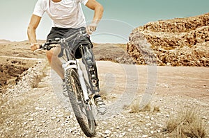 Handicapped mountain bike rider barren landscape