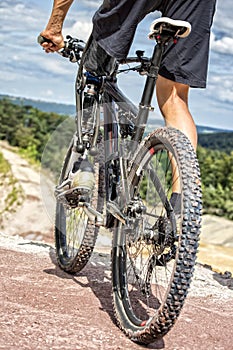 Handicapped mountain bike rider before downhill ride