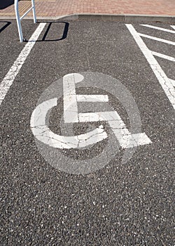 Handicapped parking. Sign of handicap infrastructure. On cement