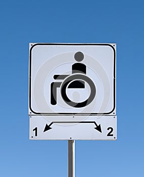 Handicapped parking sign on the road