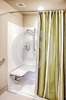 A handicapped shower stall in a rehabilitation center.