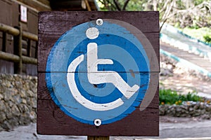 Handicapped sign at forest photograph