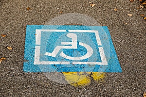 Handicapped sign mark parking spot, disabled parking permit sign on pole with convenience store in gas station area