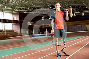 Handicapped Sportsman Holding Leg Prosthesis