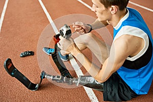 Handicapped Sportsman Repairing Prosthetic Leg