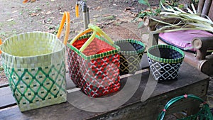 handicraft, basket made manually from plastic rope waste leather. photo