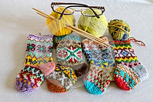 Handicraft concept, colorful knitted socks, knitting as a hobby